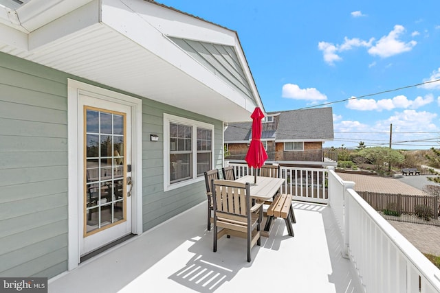 balcony featuring outdoor dining area