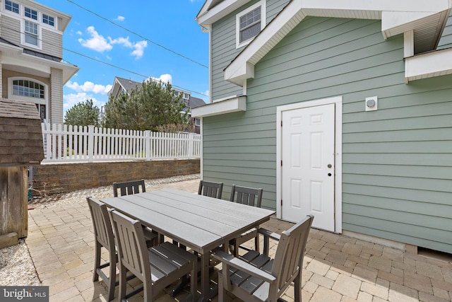 view of patio / terrace with outdoor dining area and fence