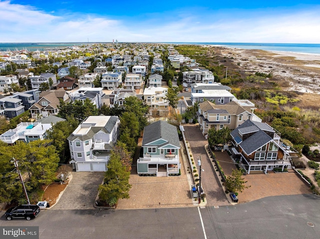 birds eye view of property featuring a water view and a residential view