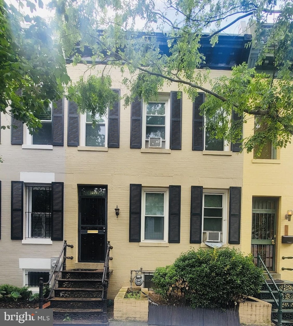 view of property featuring entry steps and cooling unit