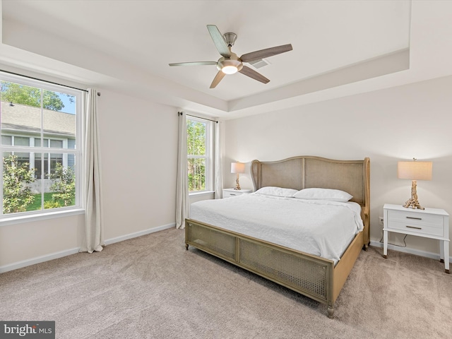 37268 Brenda Ln, Frankford, DE 19945 - carpeted bedroom featuring baseboards, a raised ceiling, and ceiling fan