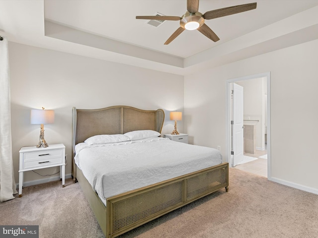 37268 Brenda Ln, Frankford, DE 19945 - carpeted bedroom featuring baseboards, a raised ceiling, ceiling fan, and ensuite bath