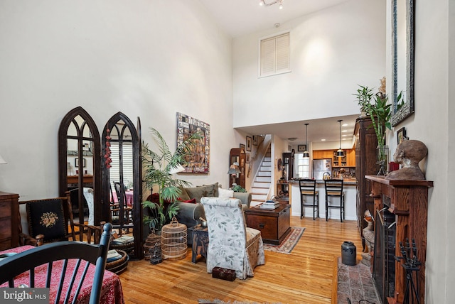 400 S 2nd St Unit 408B, Philadelphia, PA 19147 - living area featuring visible vents, plenty of natural light, wood finished floors, and stairway