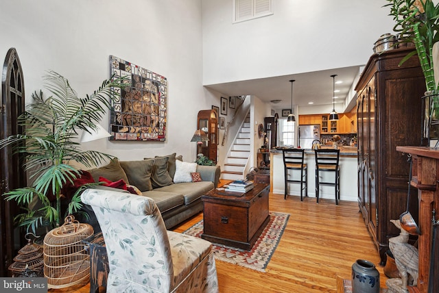400 S 2nd St Unit 408B, Philadelphia, PA 19147 - living room with light wood-style floors, stairway, and visible vents