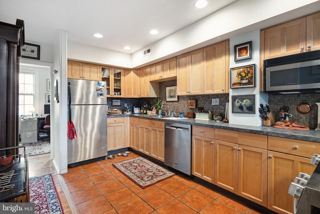 400 S 2nd St Unit 408B, Philadelphia, PA 19147 - kitchen featuring a sink, backsplash, dark countertops, and stainless steel appliances