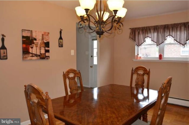 dining area with an inviting chandelier and a baseboard radiator