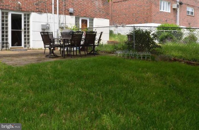 view of yard featuring a patio and fence