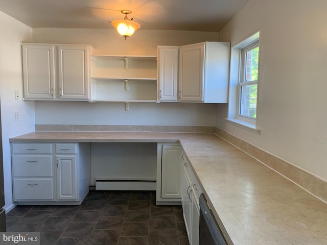 unfurnished office with a baseboard heating unit and built in study area