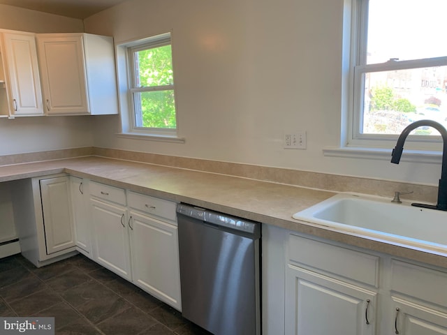 kitchen featuring a sink, dishwasher, white cabinetry, and light countertops