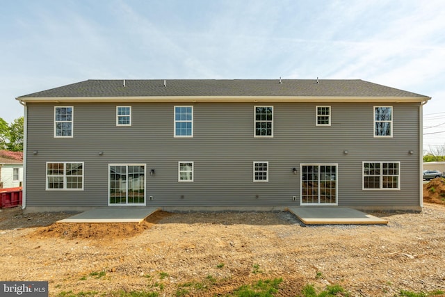 back of property with a patio area