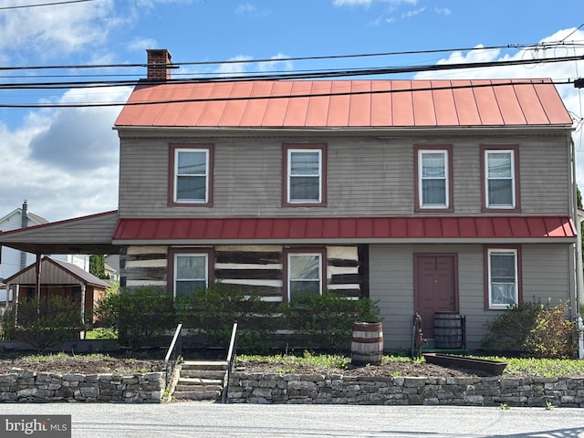 view of front facade featuring a standing seam roof and metal roof