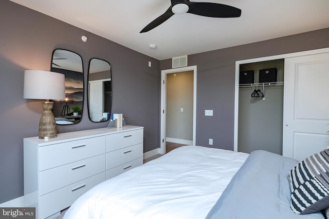 bedroom with visible vents, a ceiling fan, baseboards, and a closet