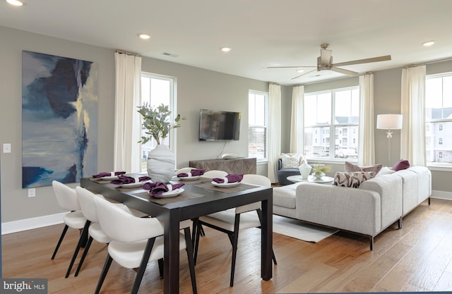dining space with recessed lighting, ceiling fan, light wood-style flooring, and baseboards