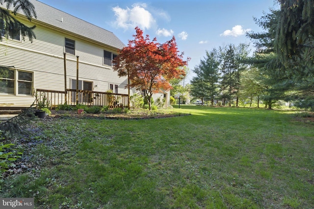 view of yard with a deck