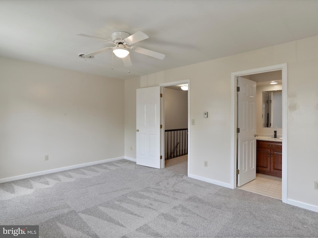321 Valley View Dr, Waynesboro, PA 17268 - unfurnished bedroom featuring light colored carpet, baseboards, a sink, connected bathroom, and ceiling fan