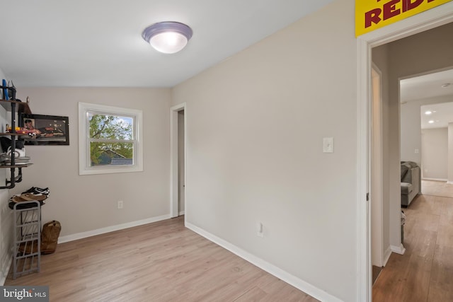 bedroom featuring baseboards and wood finished floors