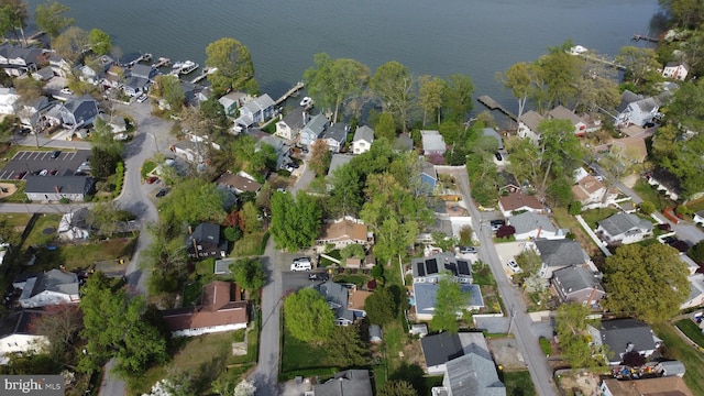 drone / aerial view featuring a water view and a residential view