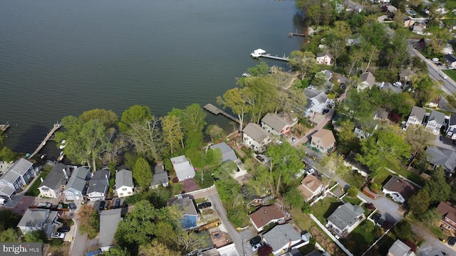 bird's eye view with a residential view and a water view