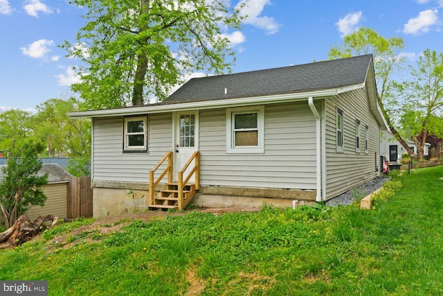 back of house featuring entry steps