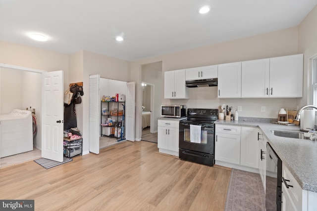 kitchen featuring stainless steel microwave, under cabinet range hood, black range with electric stovetop, a sink, and dishwasher