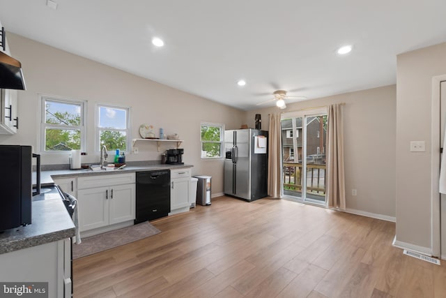 kitchen featuring ceiling fan, a sink, dishwasher, stainless steel refrigerator with ice dispenser, and visible vents