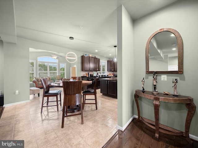 dining room featuring plenty of natural light, a ceiling fan, baseboards, and recessed lighting