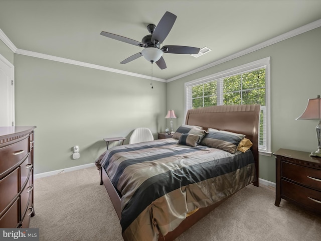 bedroom with light carpet, baseboards, crown molding, and a ceiling fan