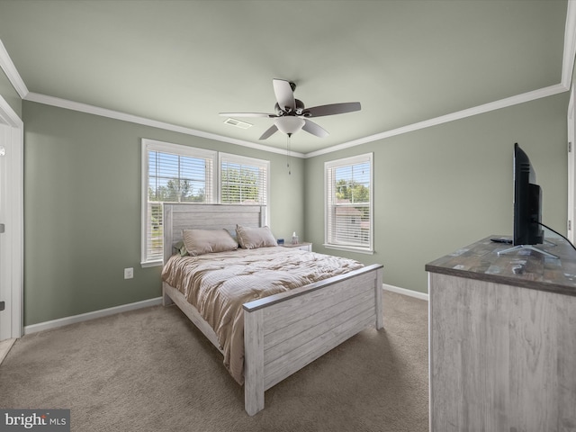 bedroom featuring light colored carpet, baseboards, crown molding, and a ceiling fan