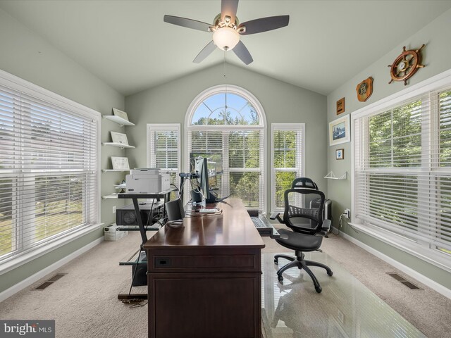 office featuring light carpet, lofted ceiling, ceiling fan, and baseboards