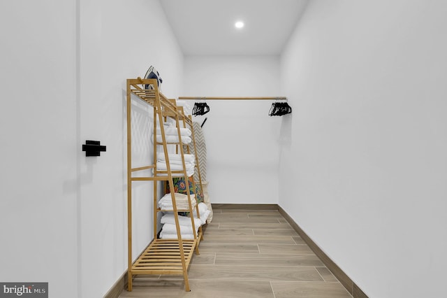 spacious closet featuring wood finished floors