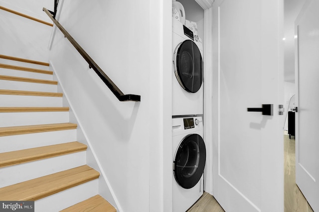 laundry room featuring laundry area and stacked washer and clothes dryer
