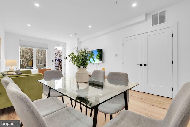 dining room with visible vents, recessed lighting, and light wood-style floors