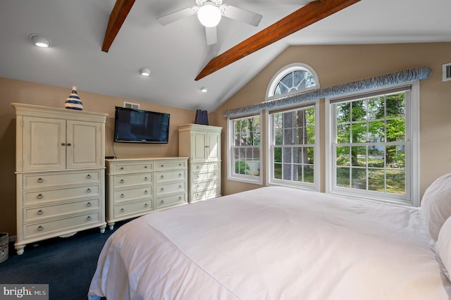 bedroom featuring ceiling fan, visible vents, vaulted ceiling with beams, and dark carpet