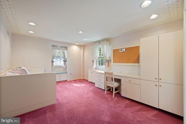 carpeted office space with recessed lighting, wallpapered walls, and built in desk