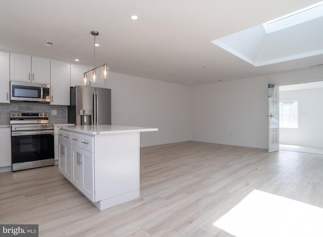 2 Edgewood Ln, Levittown, PA 19054 - kitchen with light countertops, appliances with stainless steel finishes, tasteful backsplash, and white cabinetry