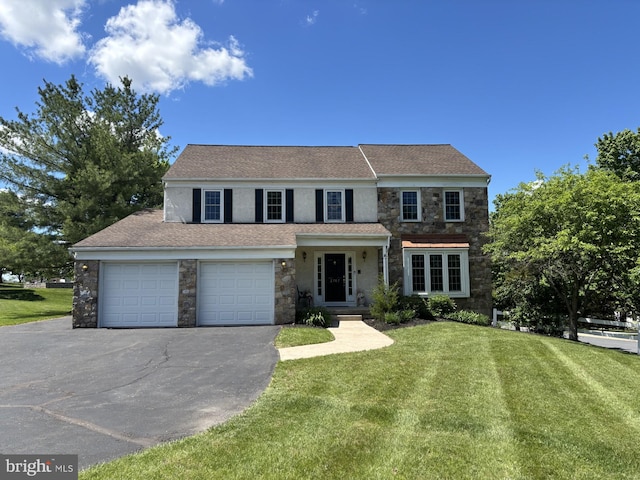2707 E Crossing Cir, Norristown, PA 19403 - traditional-style house featuring stone siding, driveway, and a front lawn
