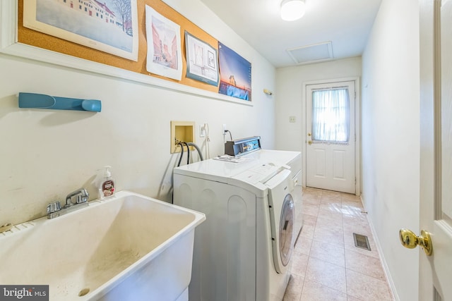 2707 E Crossing Cir, Norristown, PA 19403 - clothes washing area with washing machine and clothes dryer, light tile patterned floors, and baseboards
