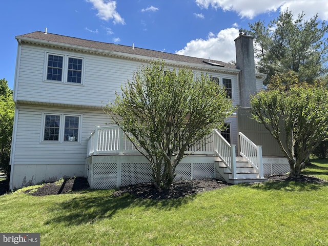 2707 E Crossing Cir, Norristown, PA 19403 - rear view of house with a yard, a deck, and a chimney