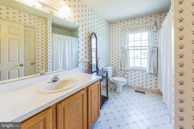 2707 E Crossing Cir, Norristown, PA 19403 - bathroom featuring wallpapered walls, tile patterned floors, vanity, toilet, and baseboards