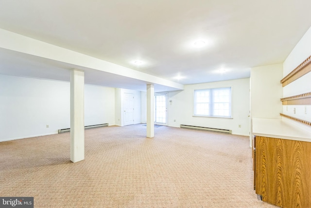 2707 E Crossing Cir, Norristown, PA 19403 - basement featuring a baseboard heating unit, light colored carpet, and baseboards