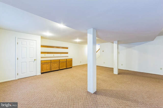2707 E Crossing Cir, Norristown, PA 19403 - finished below grade area featuring light carpet, baseboards, and stairway