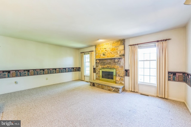 2707 E Crossing Cir, Norristown, PA 19403 - unfurnished living room featuring carpet floors, a stone fireplace, and baseboards