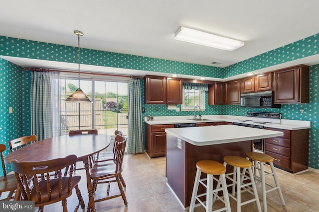 2707 E Crossing Cir, Norristown, PA 19403 - kitchen featuring wallpapered walls, black microwave, range with electric cooktop, a sink, and light countertops