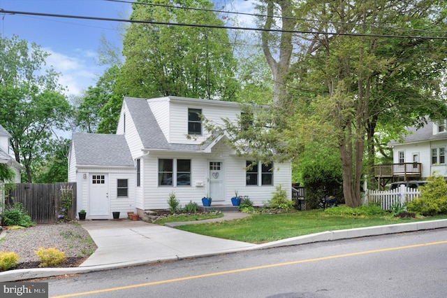 628 Edge Hill Rd, Glenside, PA 19038 - view of front facade featuring a shingled roof, concrete driveway, and fence
