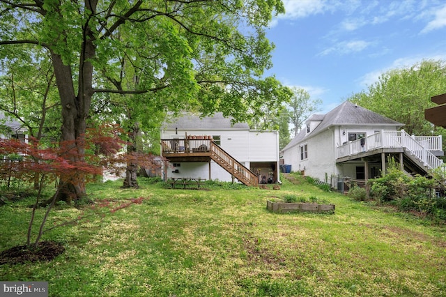 628 Edge Hill Rd, Glenside, PA 19038 - back of property with stairs, a deck, and a yard