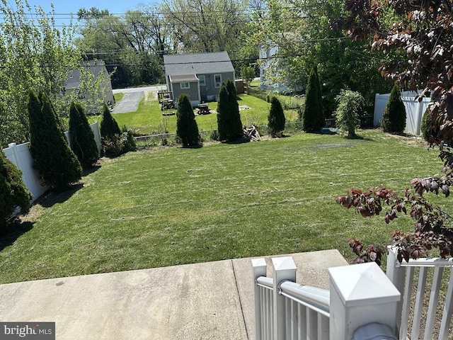 view of yard with a fenced backyard