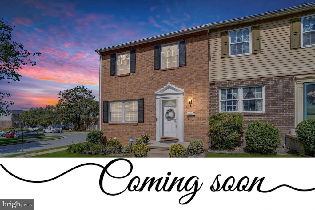 townhome / multi-family property featuring brick siding