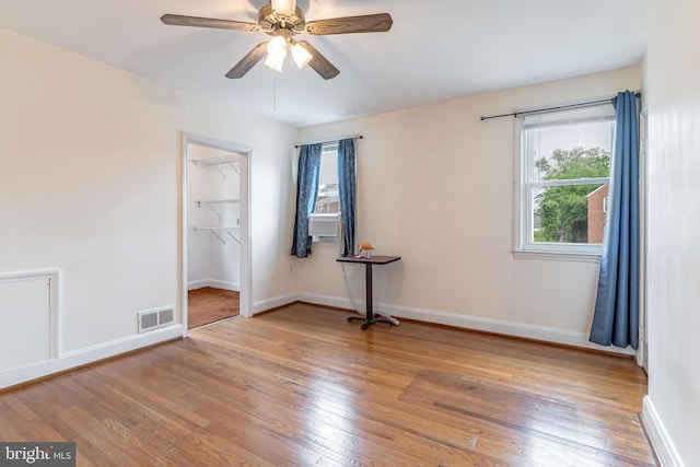 unfurnished room featuring light wood-style floors and baseboards