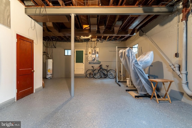 basement featuring water heater and heating unit