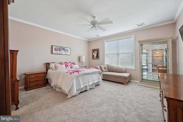 carpeted bedroom featuring baseboards, visible vents, ornamental molding, and a ceiling fan